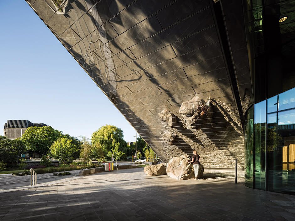 Tiled facade wraps curved convention centre by Woods Bagot and Warren & Mahoney