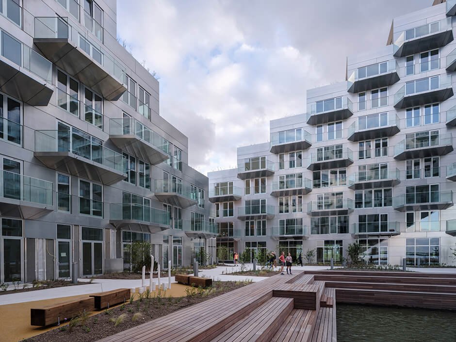 BIG and Barcode Architects cantilever housing block over IJ lake in Amsterdam