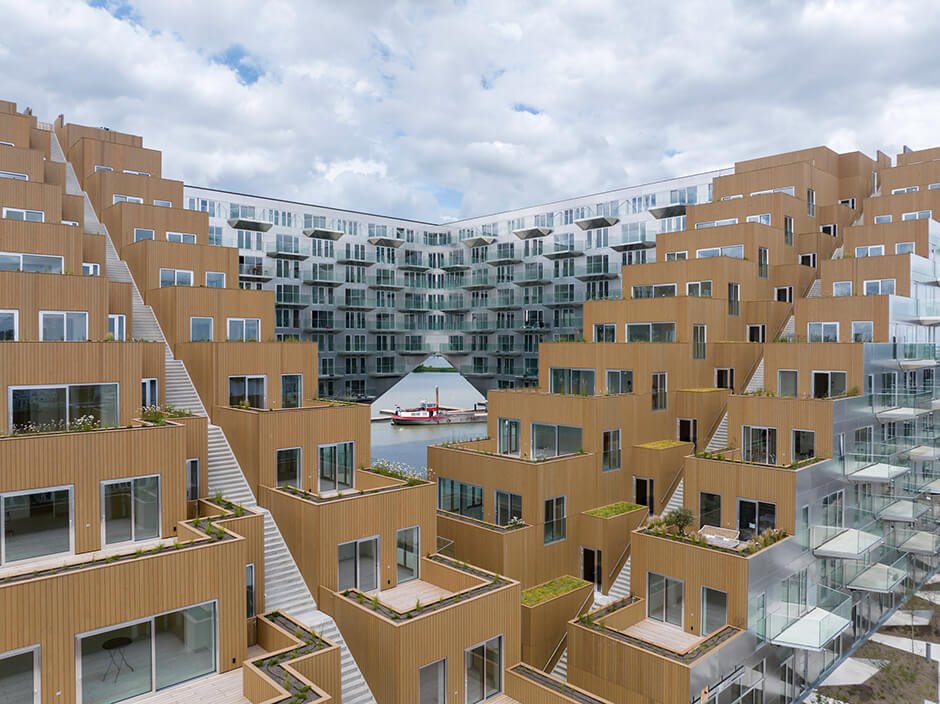 BIG and Barcode Architects cantilever housing block over IJ lake in Amsterdam