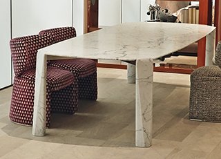 CPRN presents the new VICTOR table in Statuarietto marble and a small EMILIA armchair.